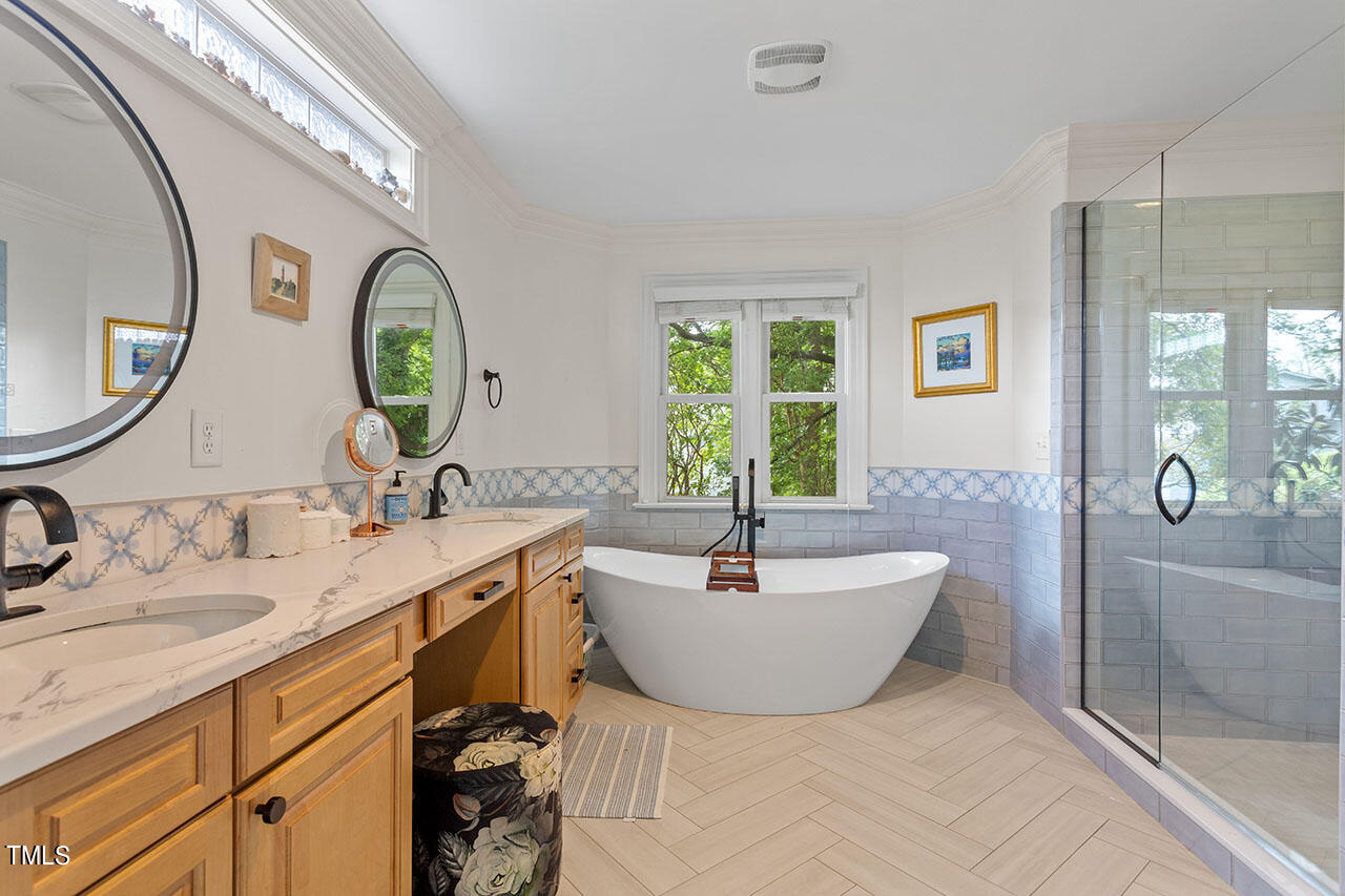 808 Elm Street Raleigh, NC 27604 - Photo 28 of 44 a spacious bathroom with a sink and a mirror