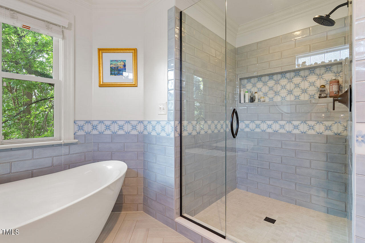 808 Elm Street Raleigh, NC 27604 - Photo 30 of 44 a bathroom with a bathtub and a shower