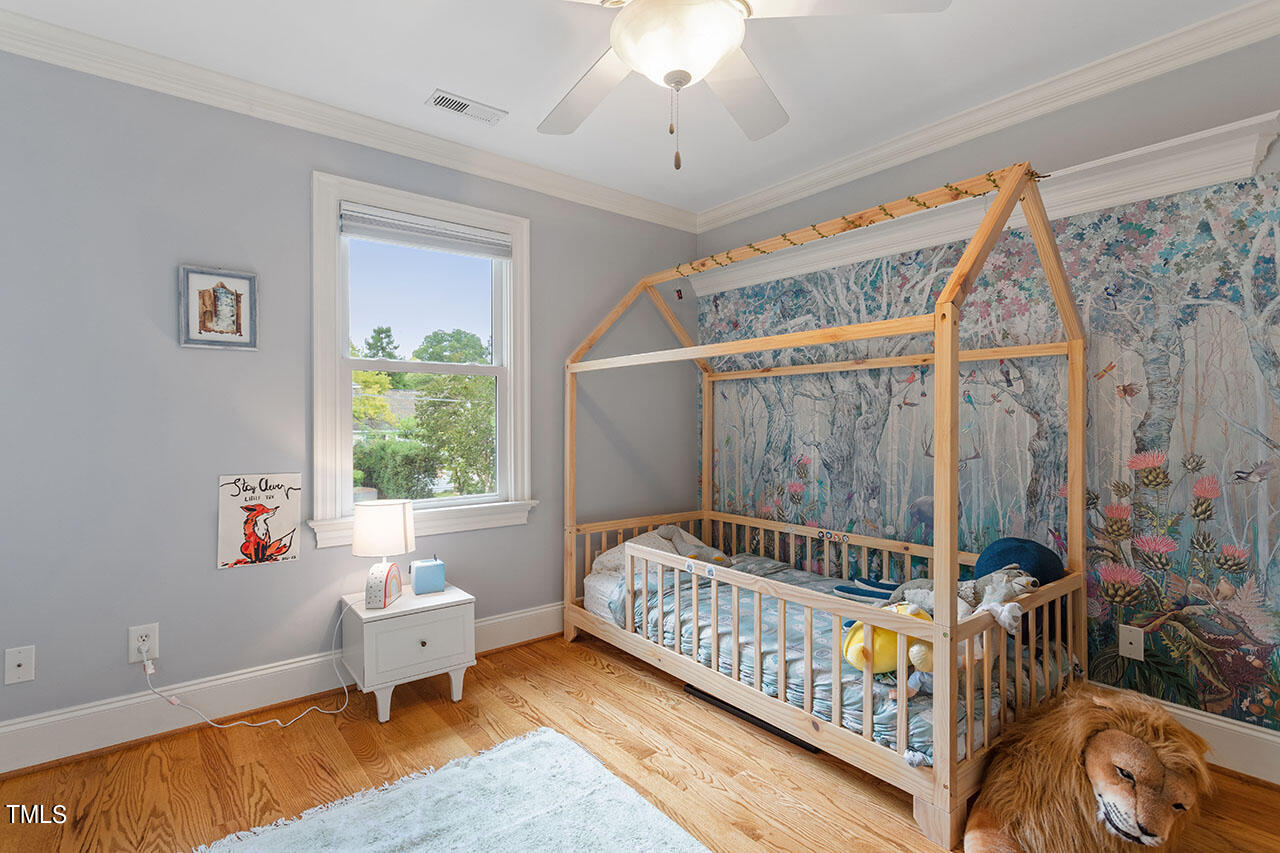 808 Elm Street Raleigh, NC 27604 - Photo 32 of 44 a bedroom with furniture and a window