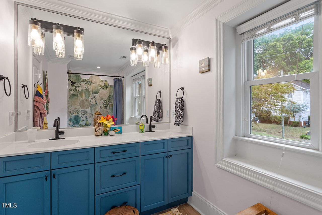 808 Elm Street Raleigh, NC 27604 - Photo 33 of 44 a bathroom with a double vanity sink and a mirror