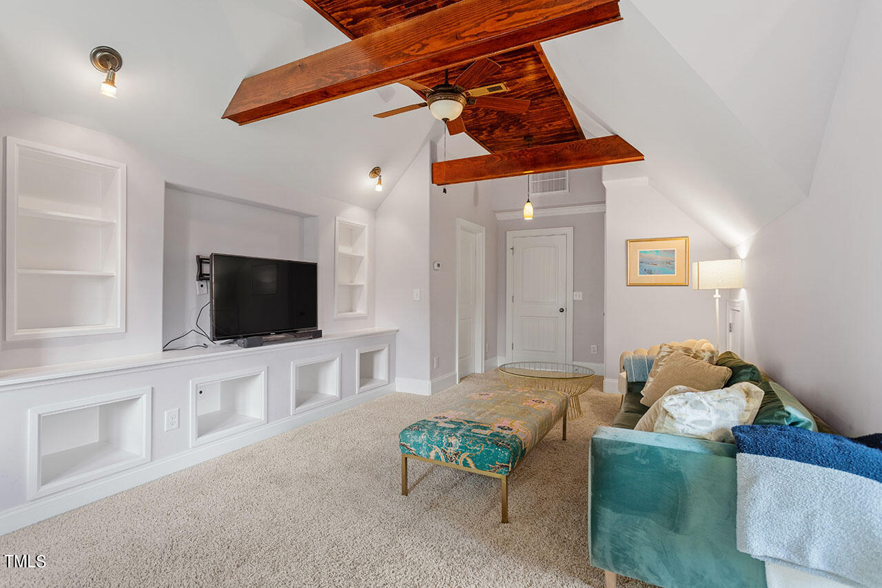 808 Elm Street Raleigh, NC 27604 - Photo 38 of 44 a living room with furniture and a flat screen tv