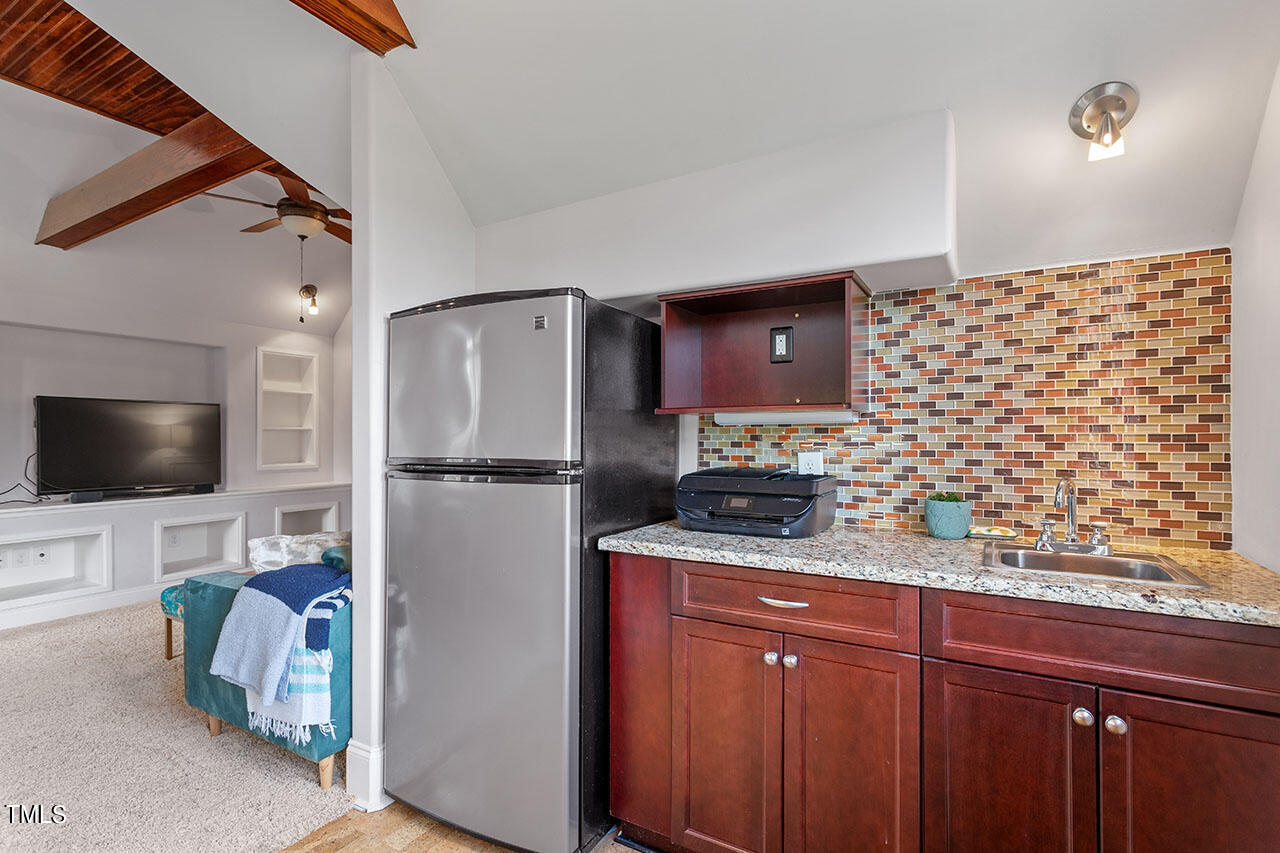 808 Elm Street Raleigh, NC 27604 - Photo 40 of 44 a kitchen with stainless steel appliances a refrigerator and a stove top oven