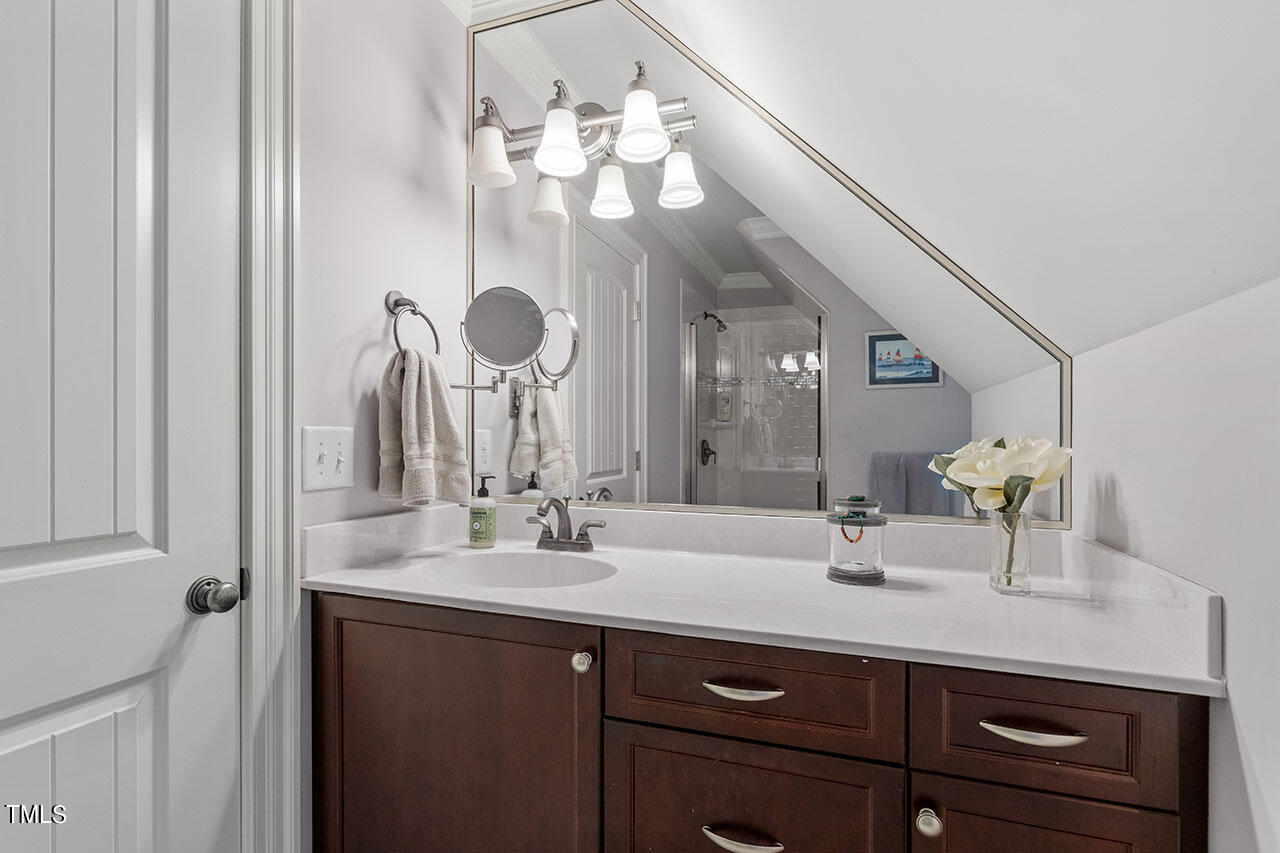 808 Elm Street Raleigh, NC 27604 - Photo 41 of 44 a bathroom with a sink and a mirror