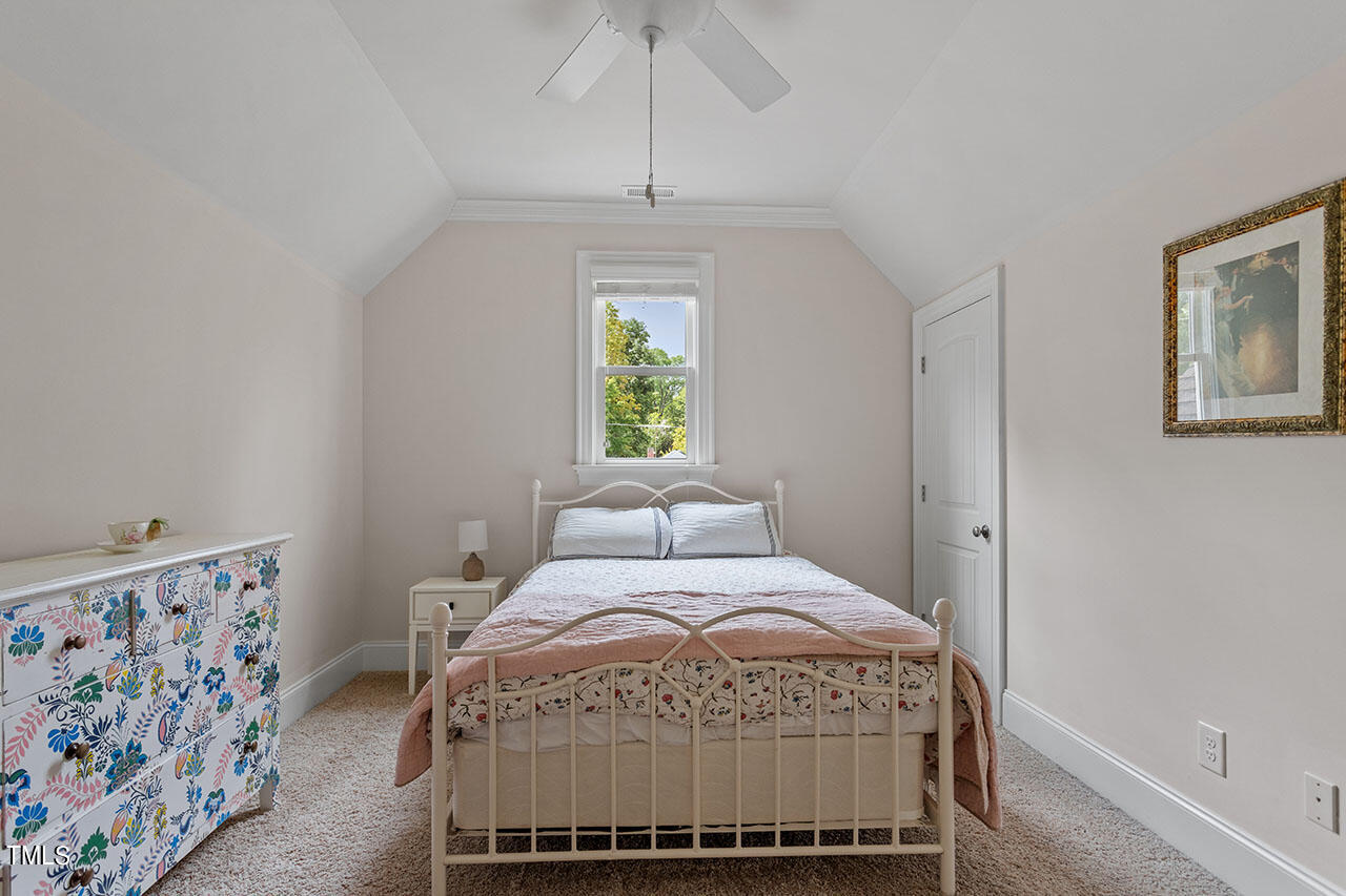 808 Elm Street Raleigh, NC 27604 - Photo 42 of 44 a bedroom with a bed and a window