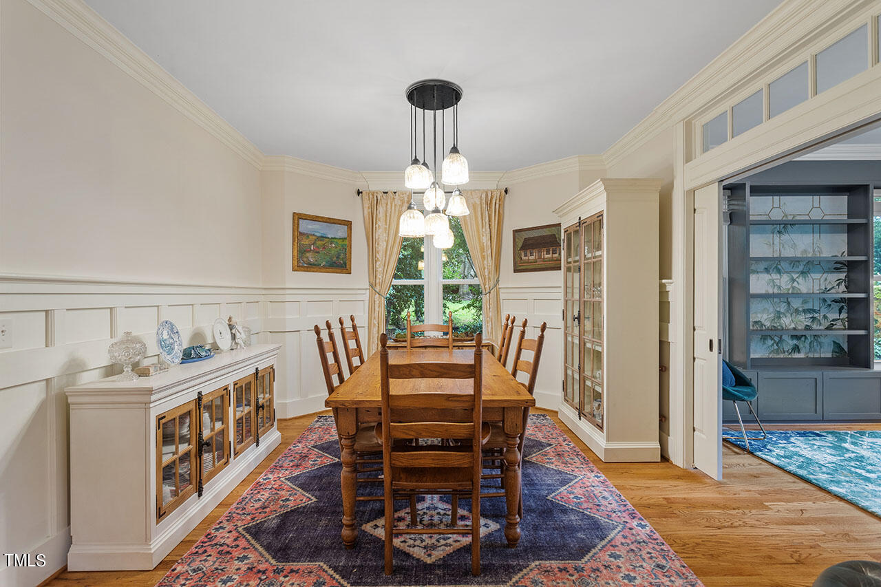 808 Elm Street Raleigh, NC 27604 - Photo 10 of 44 a view of a dining room with furniture window and wooden floor
