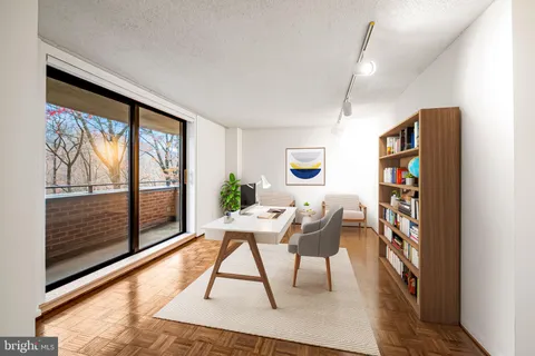 a workspace with furniture and a window