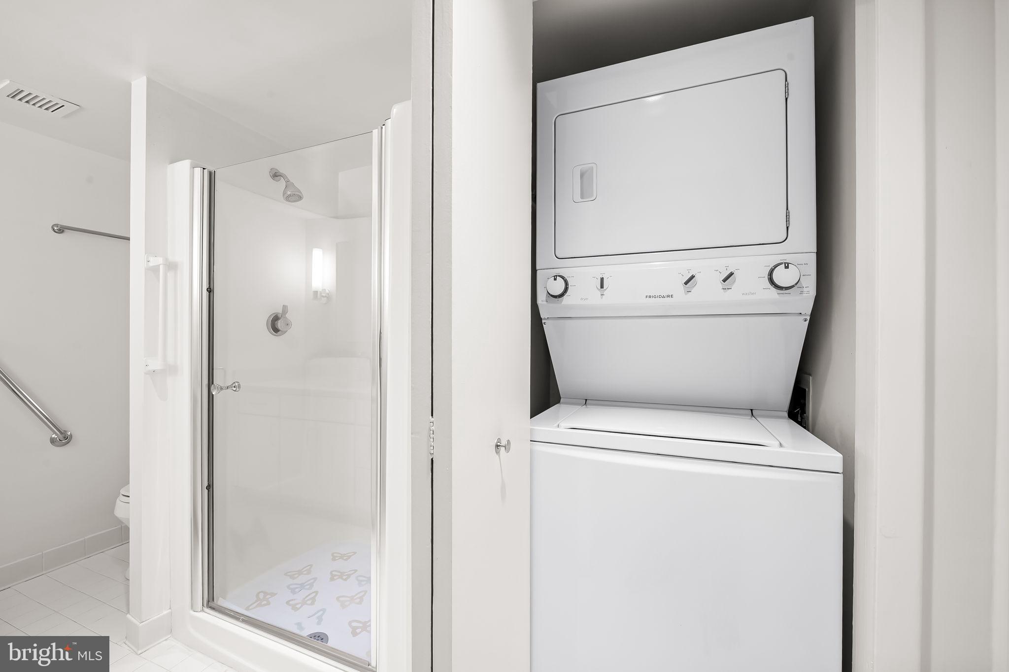 111 Hamlet Hill Road, Unit 412 Baltimore, MD 21210 - Photo 21 of 33 a white toilet sitting next to a bathroom sink