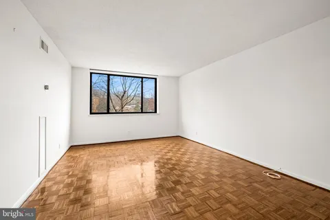 a view of an empty room with a window