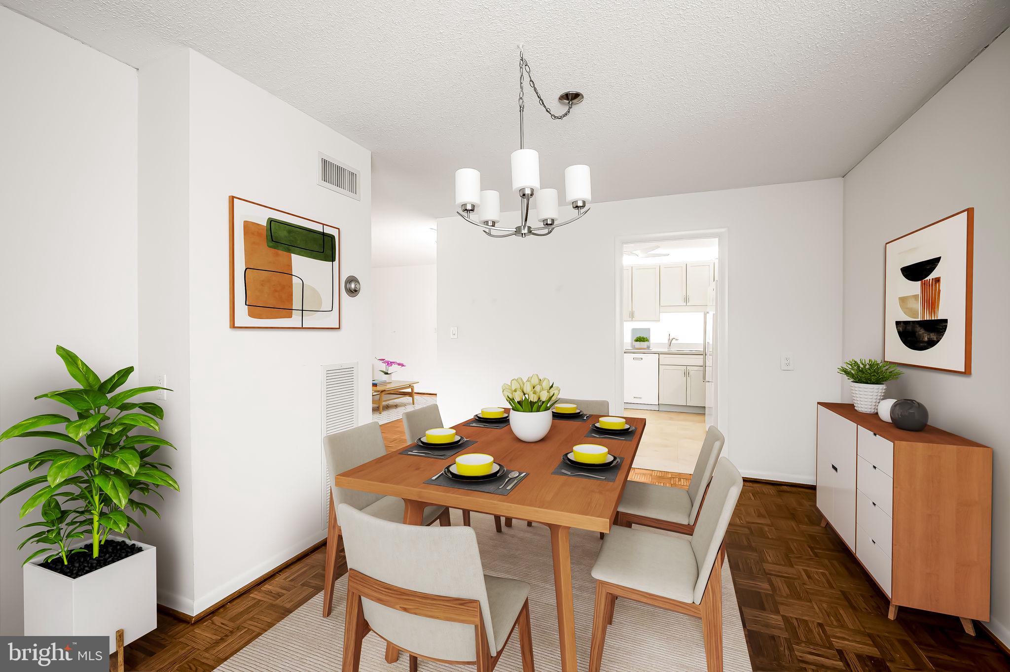 111 Hamlet Hill Road, Unit 412 Baltimore, MD 21210 - Photo 8 of 33 a view of a dining room with furniture and wooden floor