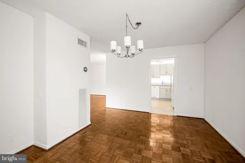 a view of a chandelier in an empty room