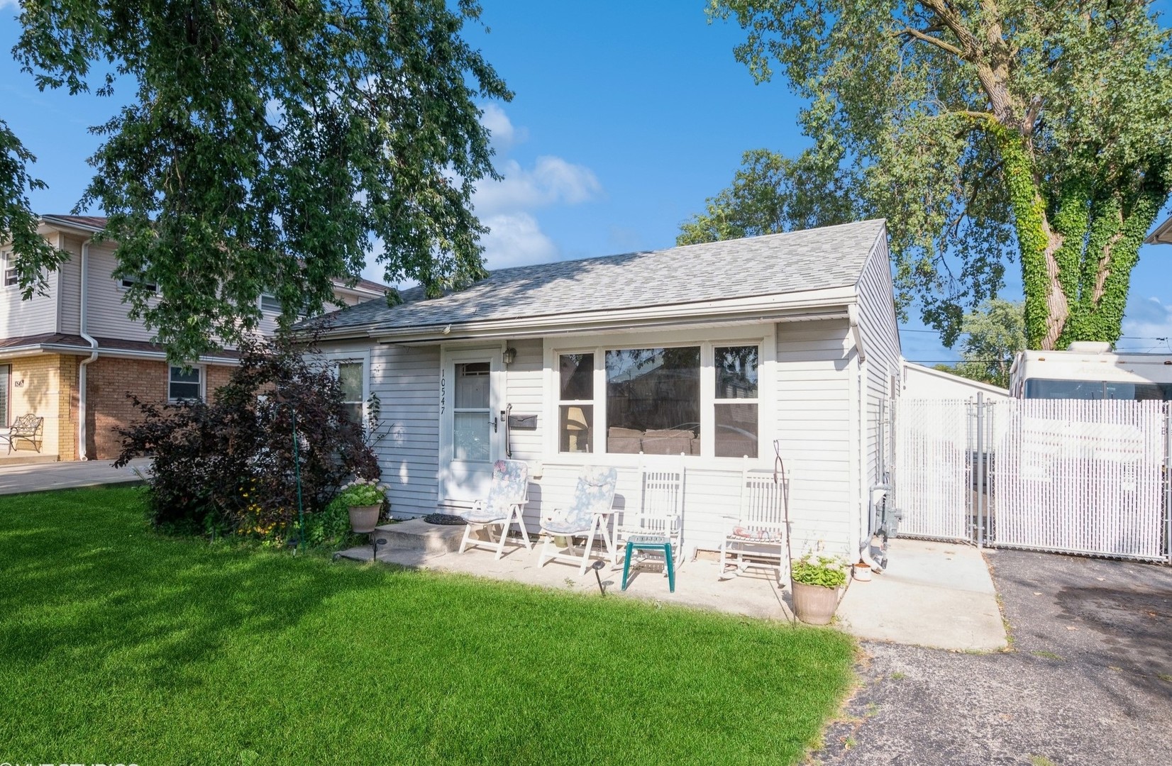 10547 Princess Avenue Chicago Ridge, IL 60415 - Photo 2 of 15 front view of a house with a yard and a trees