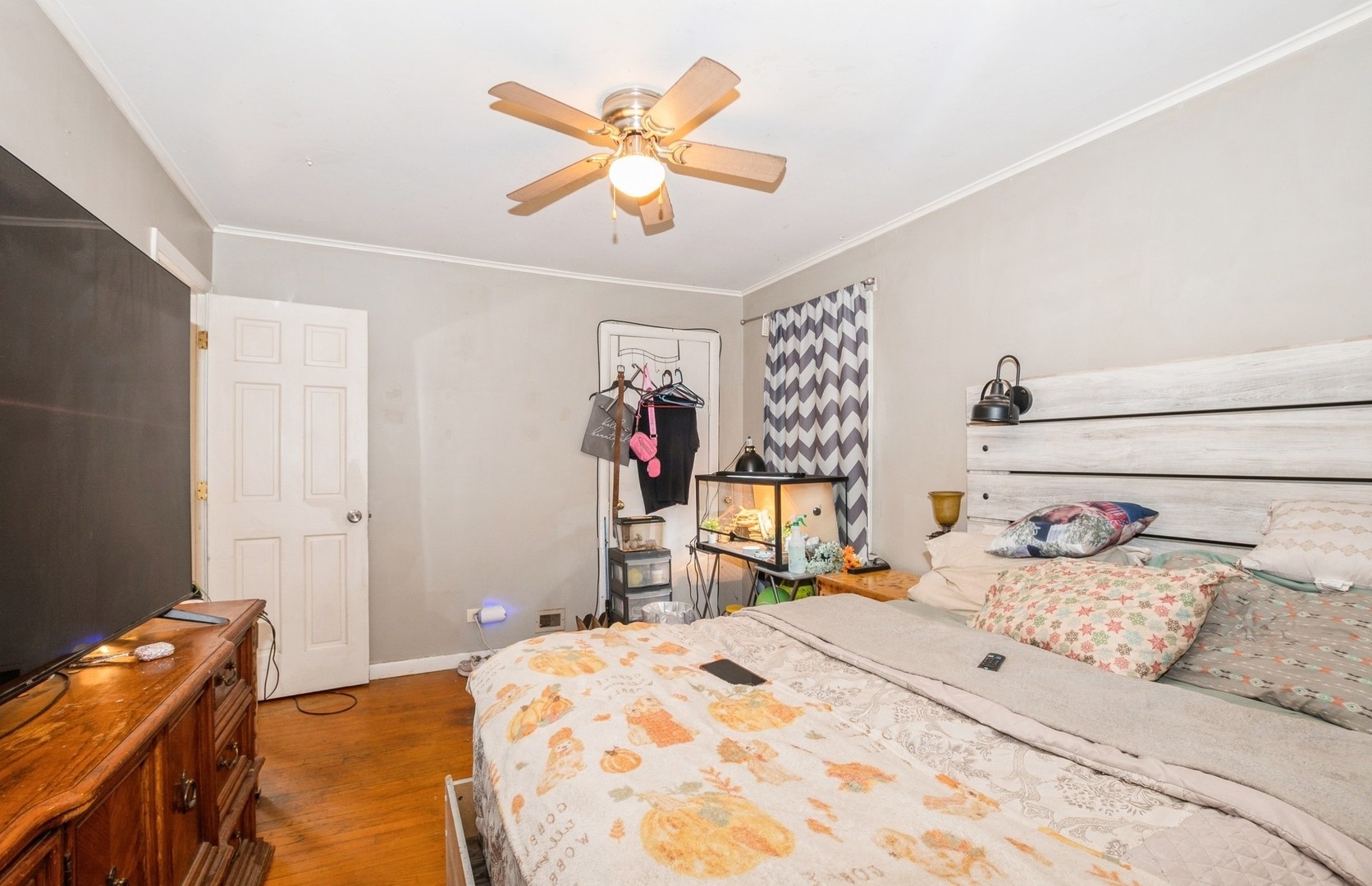10547 Princess Avenue Chicago Ridge, IL 60415 - Photo 9 of 15 a bed room with a bed and a chandelier