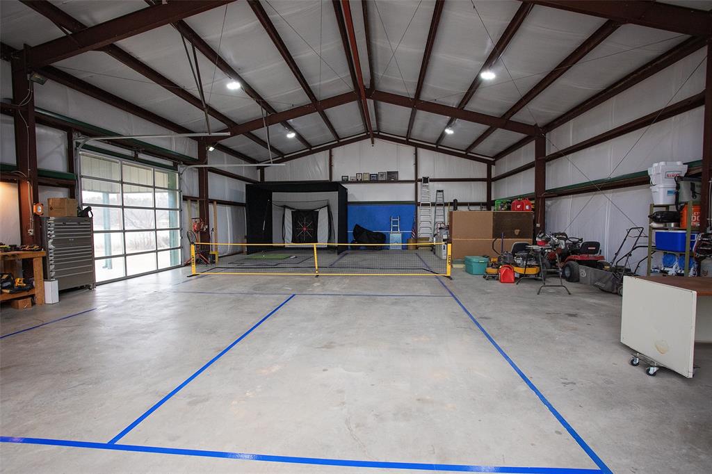 4827 Green Acres Road Graham, TX 76450 - Photo 11 of 32 a view of a garage with storage
