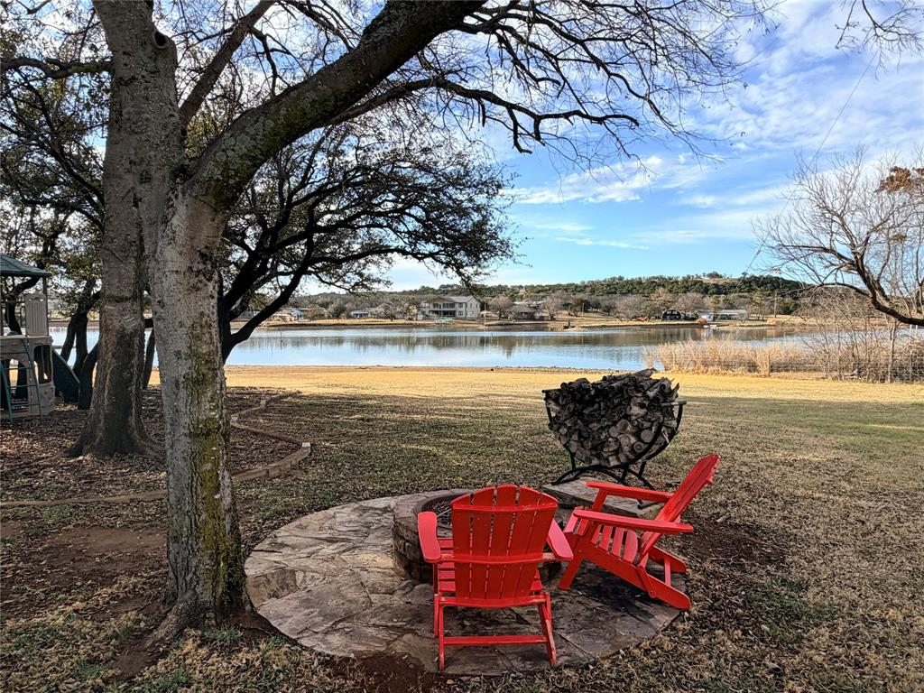 4827 Green Acres Road Graham, TX 76450 - Photo 13 of 32 a view of a yard with furniture and lake view