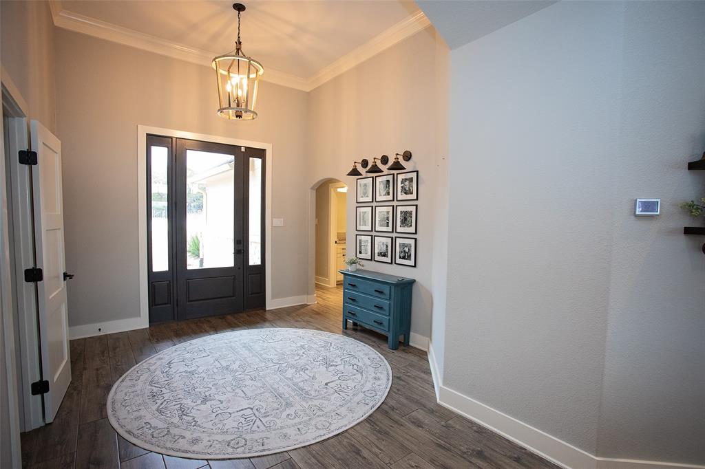 4827 Green Acres Road Graham, TX 76450 - Photo 17 of 32 wooden floor and windows in a room