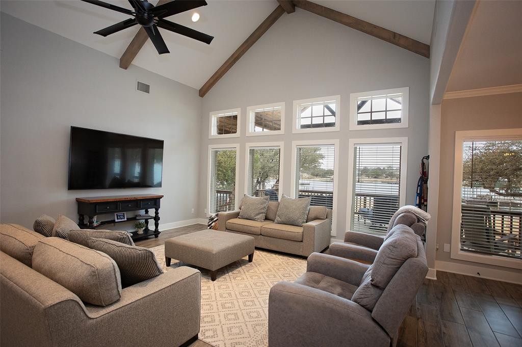 4827 Green Acres Road Graham, TX 76450 - Photo 18 of 32 a living room with furniture and a flat screen tv