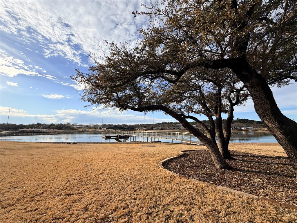 4827 Green Acres Road Graham, TX 76450 - Photo 2 of 32 a view of swimming pool with an outdoor space and seating area