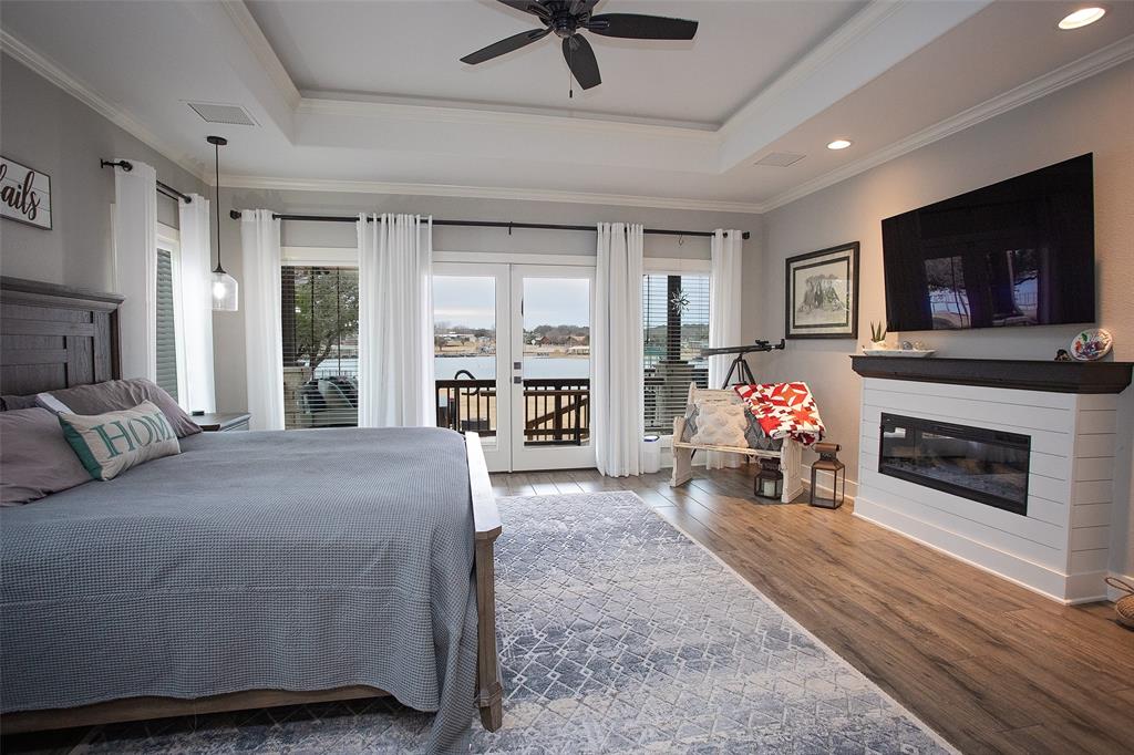 4827 Green Acres Road Graham, TX 76450 - Photo 25 of 32 a bed room with a bed and a television