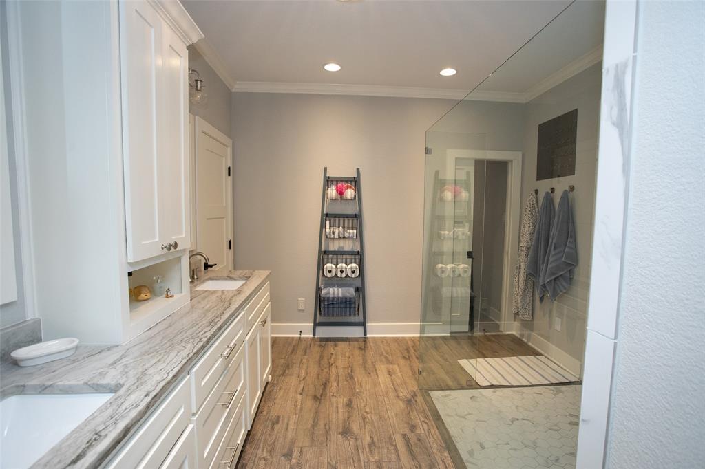 4827 Green Acres Road Graham, TX 76450 - Photo 26 of 32 a bathroom with a double vanity sink and a mirror