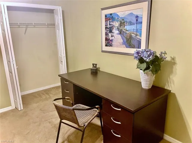 a view of a workspace with furniture