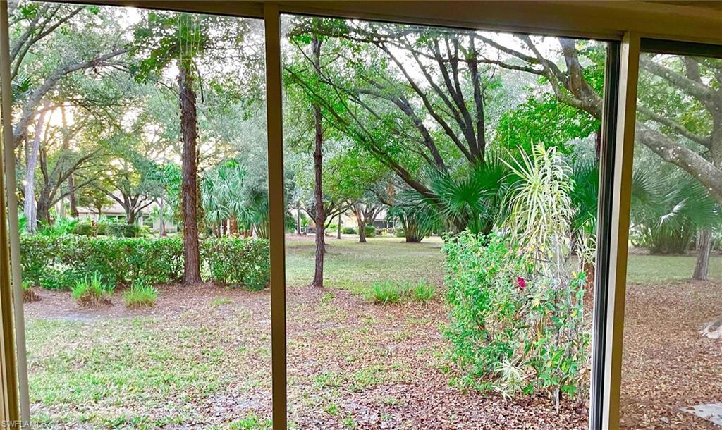 3634 Stone Way Estero, FL 33928 - Photo 18 of 27 a view of a yard with plants and large trees