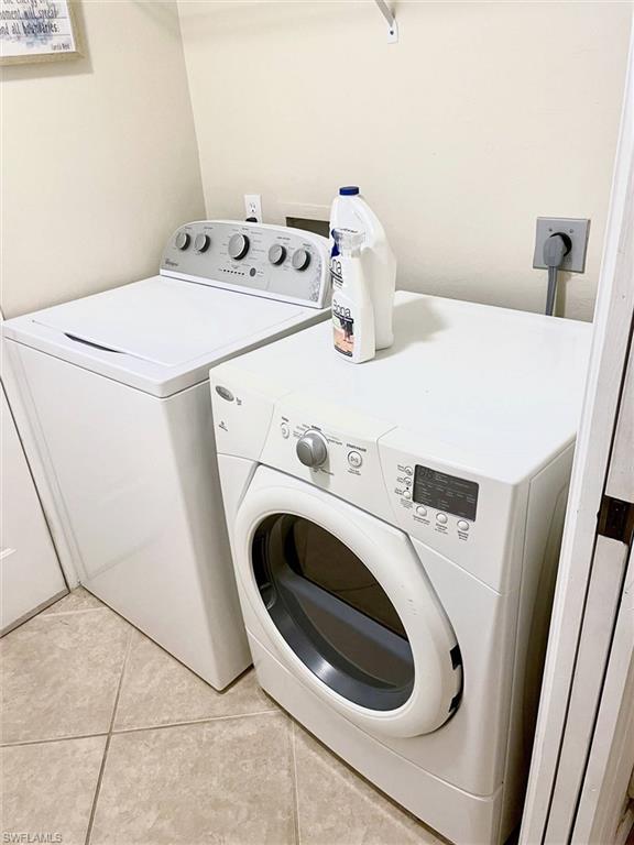3634 Stone Way Estero, FL 33928 - Photo 19 of 27 a utility room with dryer and washer