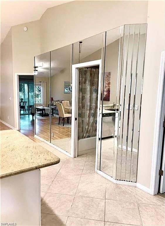 3634 Stone Way Estero, FL 33928 - Photo 5 of 27 a kitchen with stainless steel appliances kitchen island granite countertop a refrigerator and a sink