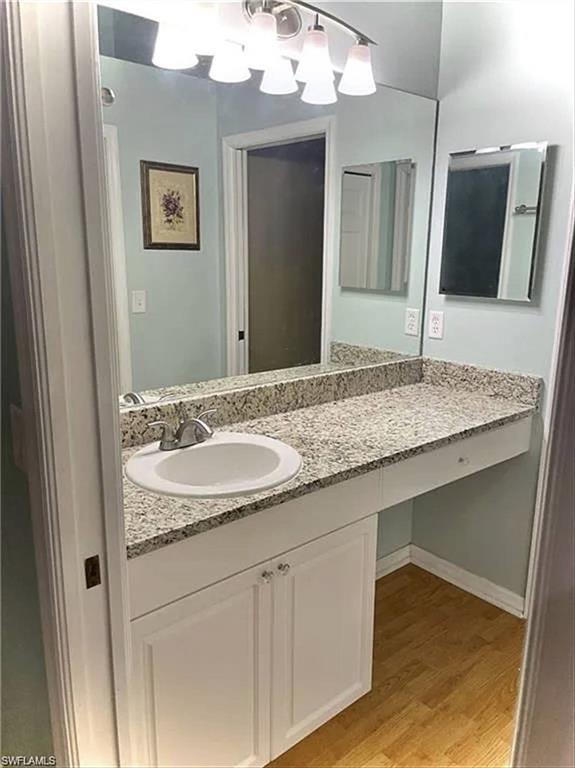 3634 Stone Way Estero, FL 33928 - Photo 10 of 27 a bathroom with a sink and a mirror