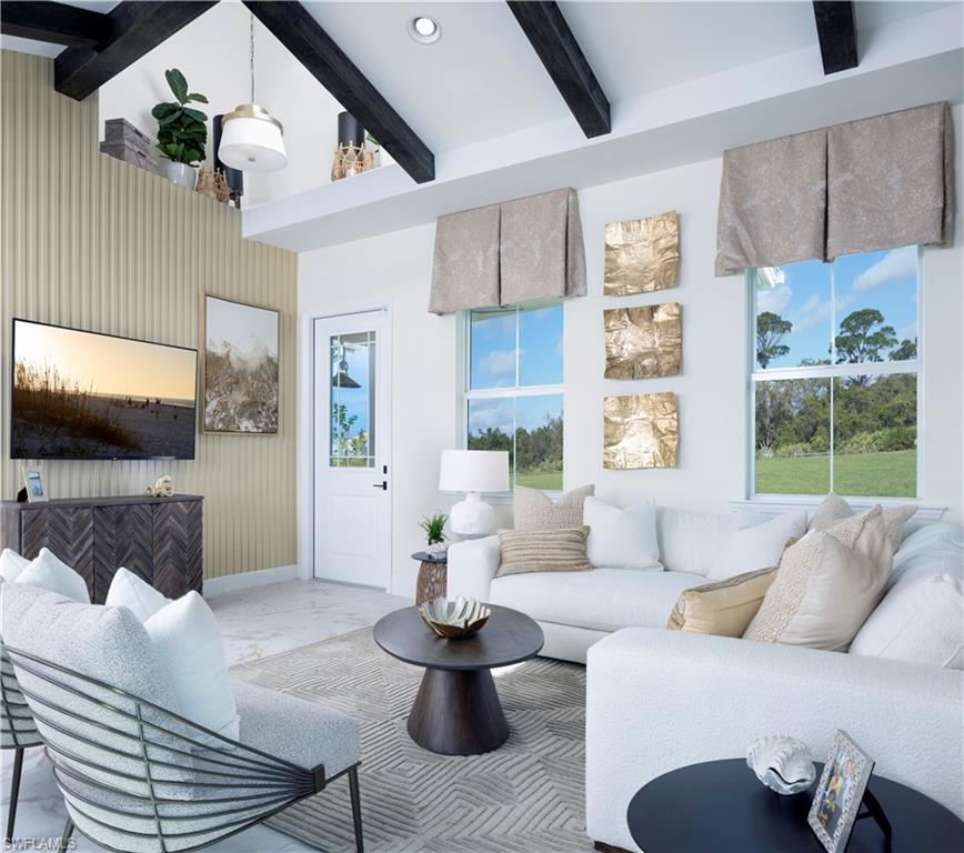 7184 Cayo Coco Lane Naples, FL 34113 - Photo 4 of 19 a living room with furniture and a flat screen tv