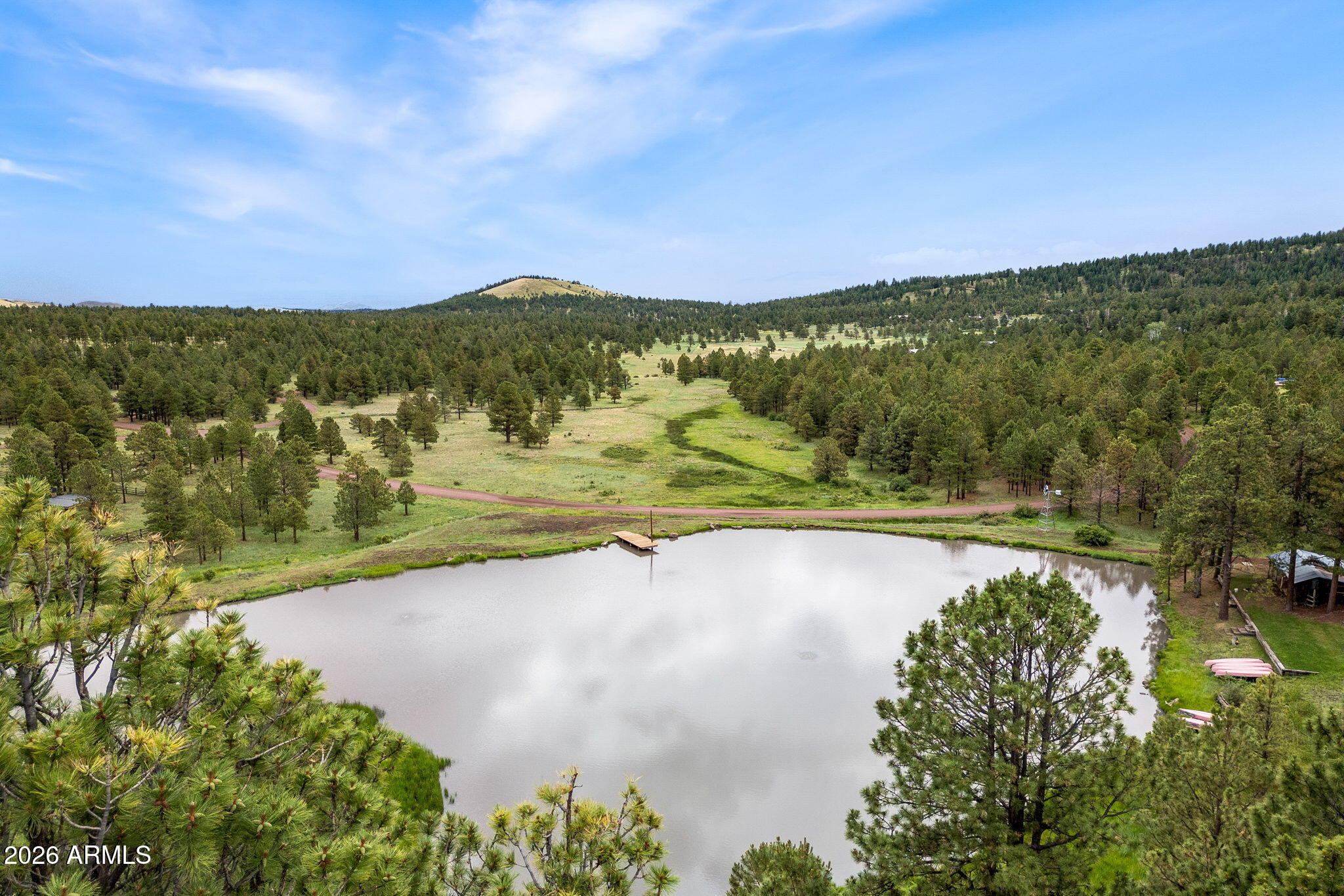 37 North 1330th, Unit 19 Greer, AZ 85927 - Photo 21 of 38 a view of a lake with a mountain in the background