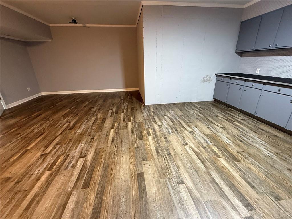 1950 Buford Dam Road, Unit 202 Cumming, GA 30041 - Photo 16 of 40 a view of a room with wooden floor