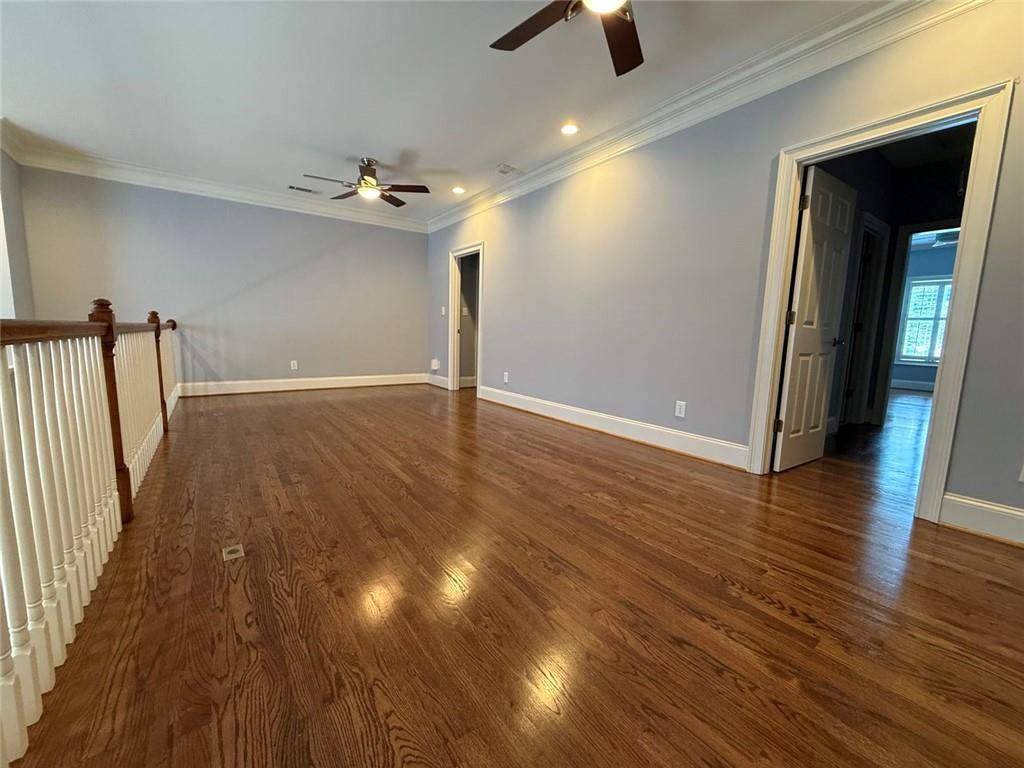 1950 Buford Dam Road, Unit 202 Cumming, GA 30041 - Photo 21 of 40 wooden floor in an empty room with a window