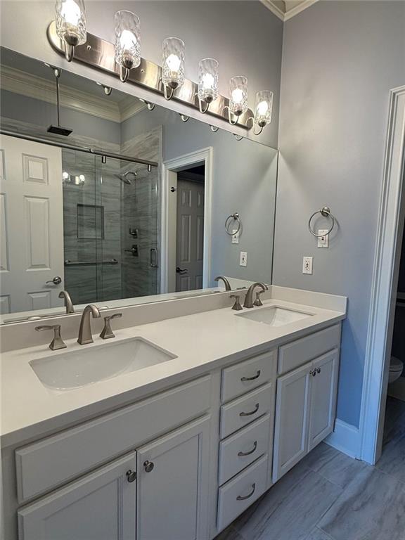 1950 Buford Dam Road, Unit 202 Cumming, GA 30041 - Photo 25 of 40 a bathroom with double vanity sinks and a mirror