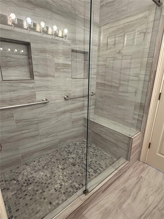 1950 Buford Dam Road, Unit 202 Cumming, GA 30041 - Photo 26 of 40 a bathroom with a shower