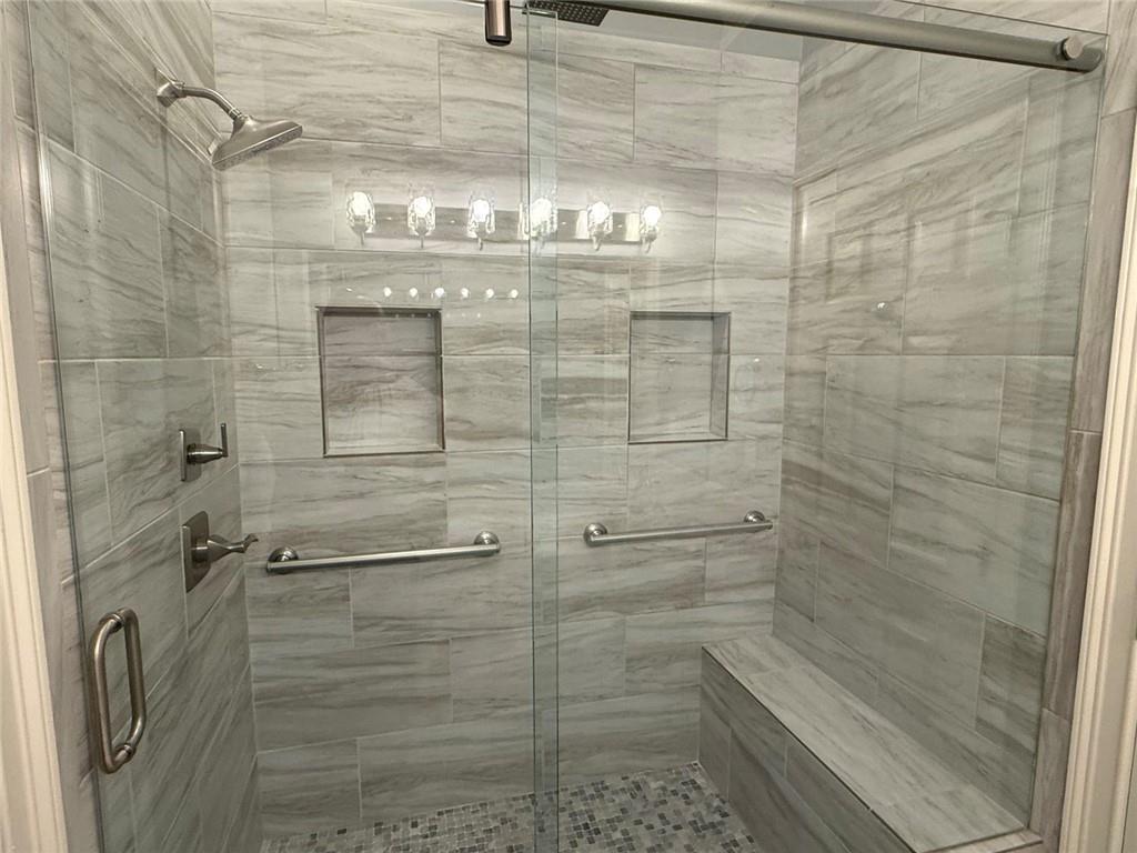 1950 Buford Dam Road, Unit 202 Cumming, GA 30041 - Photo 27 of 40 a bathroom with a shower
