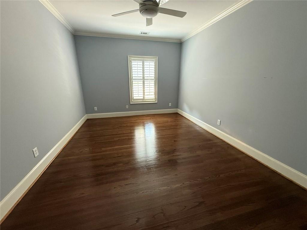 1950 Buford Dam Road, Unit 202 Cumming, GA 30041 - Photo 30 of 40 an empty room with wooden floor and windows