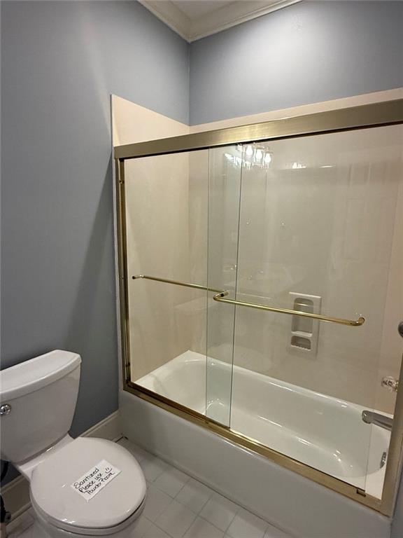 1950 Buford Dam Road, Unit 202 Cumming, GA 30041 - Photo 31 of 40 a bathroom with a toilet and a shower