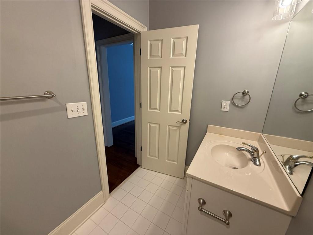 1950 Buford Dam Road, Unit 202 Cumming, GA 30041 - Photo 33 of 40 a bathroom with a sink and tub