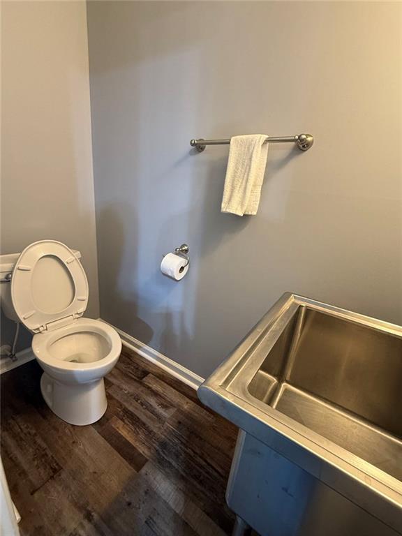 1950 Buford Dam Road, Unit 202 Cumming, GA 30041 - Photo 34 of 40 a bathroom with a toilet and a sink