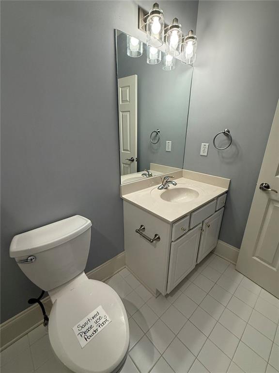 1950 Buford Dam Road, Unit 202 Cumming, GA 30041 - Photo 35 of 40 a bathroom with a sink toilet and mirror