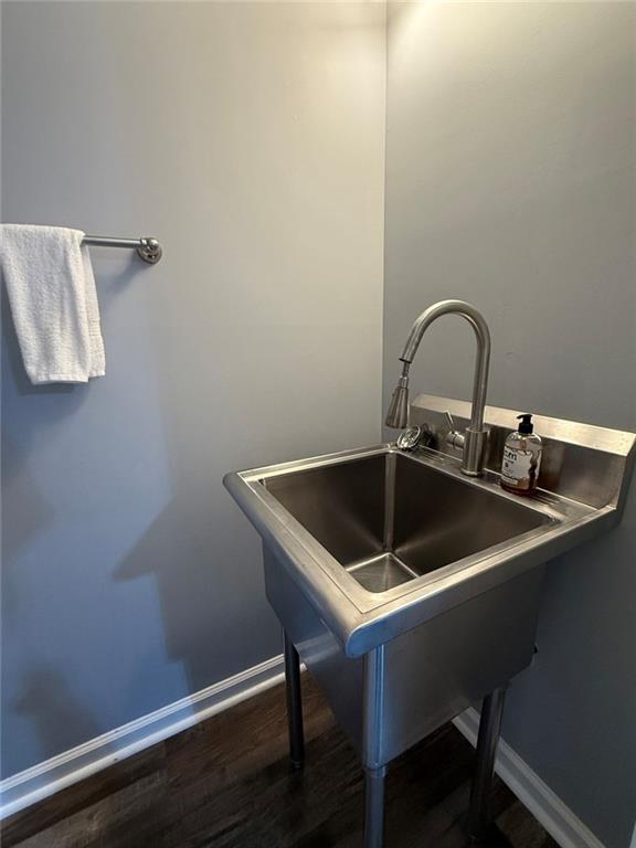1950 Buford Dam Road, Unit 202 Cumming, GA 30041 - Photo 36 of 40 a kitchen with a sink and cabinets