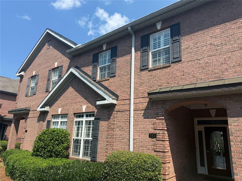 1950 Buford Dam Road, Unit 202 Cumming, GA 30041 - Photo 4 of 40 front view of a house