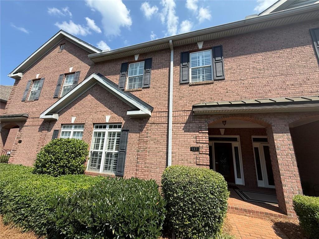 1950 Buford Dam Road, Unit 202 Cumming, GA 30041 - Photo 7 of 40 front view of a house