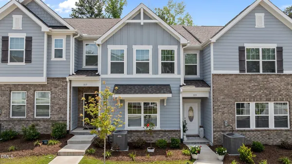 a front view of a house with a yard