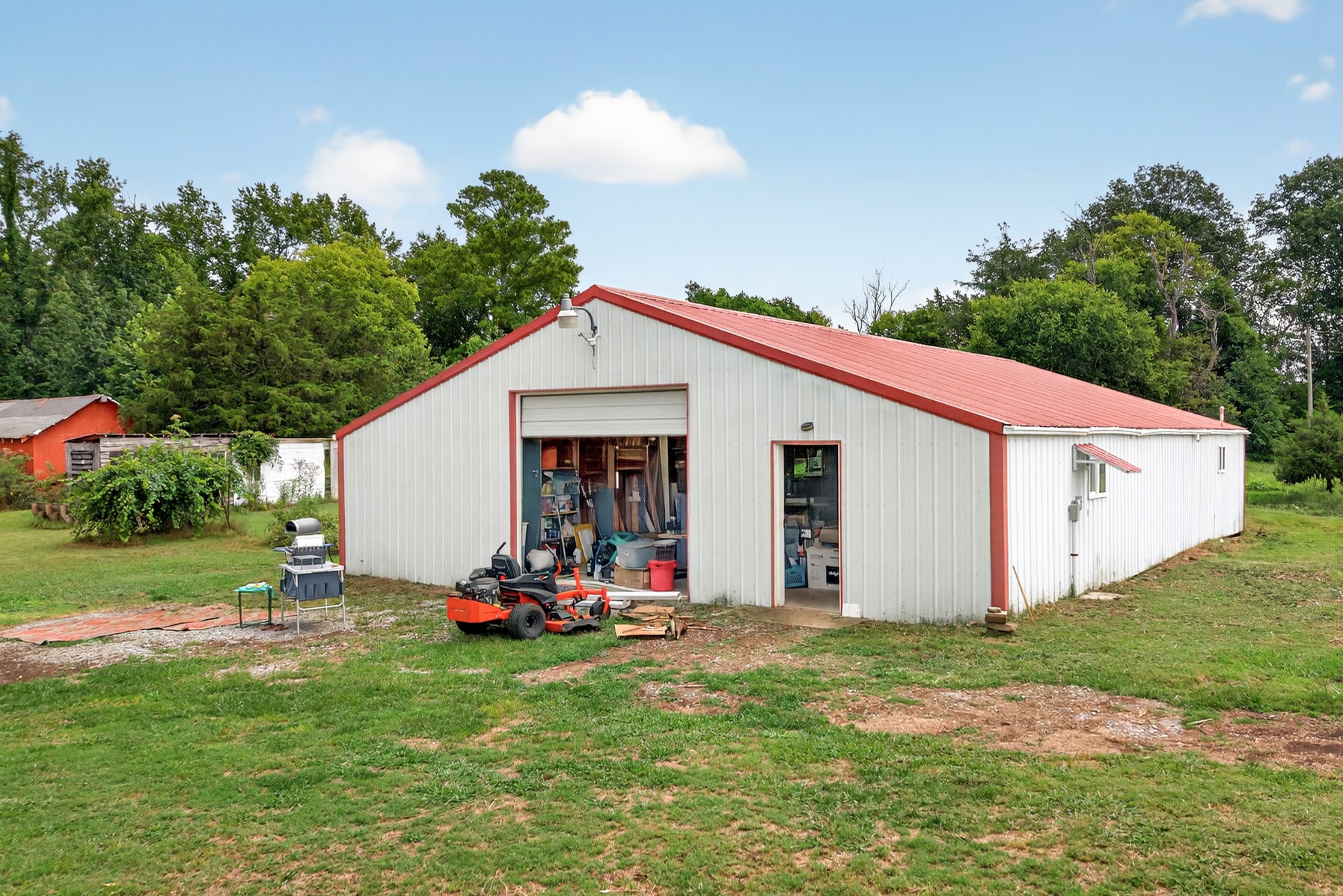 34383 Ardmore Ridge Road Prospect, TN 38477 - Photo 34 of 51 a view of a backyard with table and chairs and potted plants