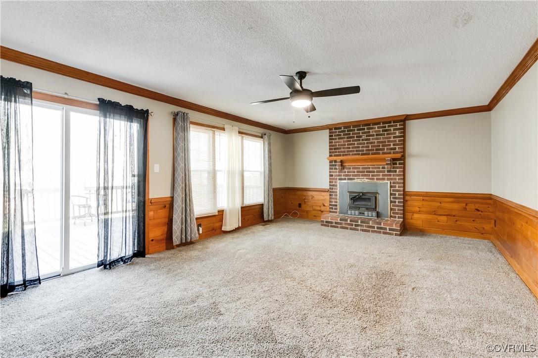 7400 Cannock Road Chesterfield, VA 23832 - Photo 12 of 36 an empty room with furniture and fireplace