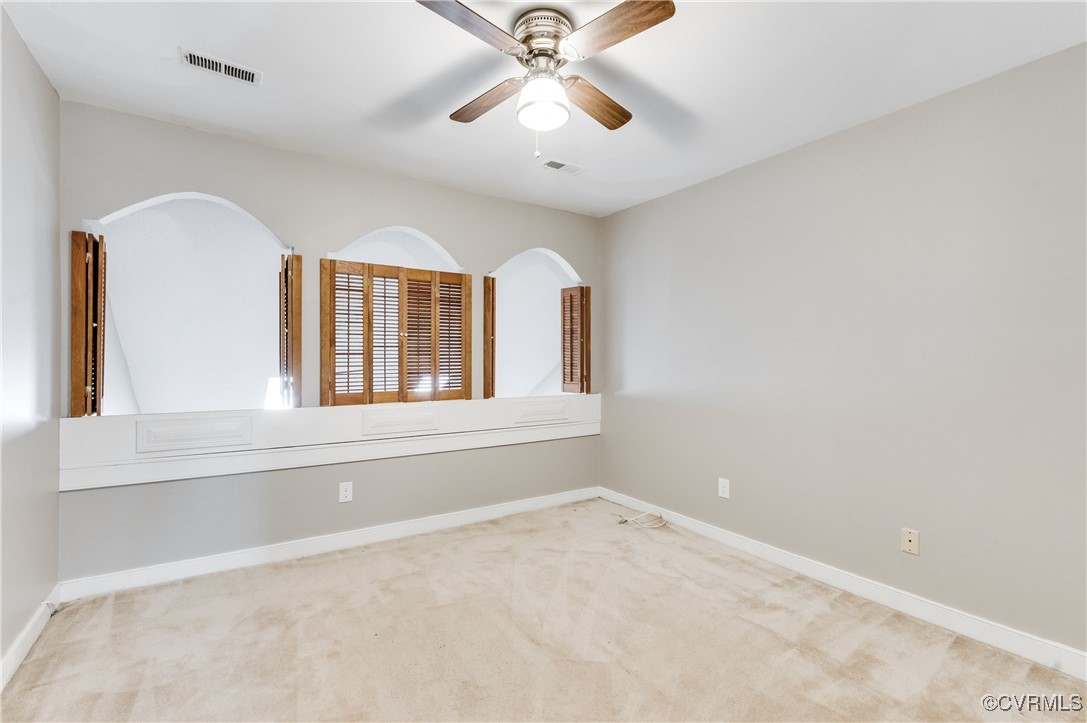 7400 Cannock Road Chesterfield, VA 23832 - Photo 20 of 36 an empty room with windows and ceiling fan