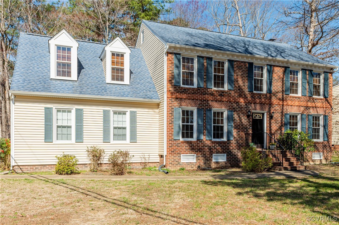 7400 Cannock Road Chesterfield, VA 23832 - Photo 2 of 36 a view of a brick house with many windows and wooden walls
