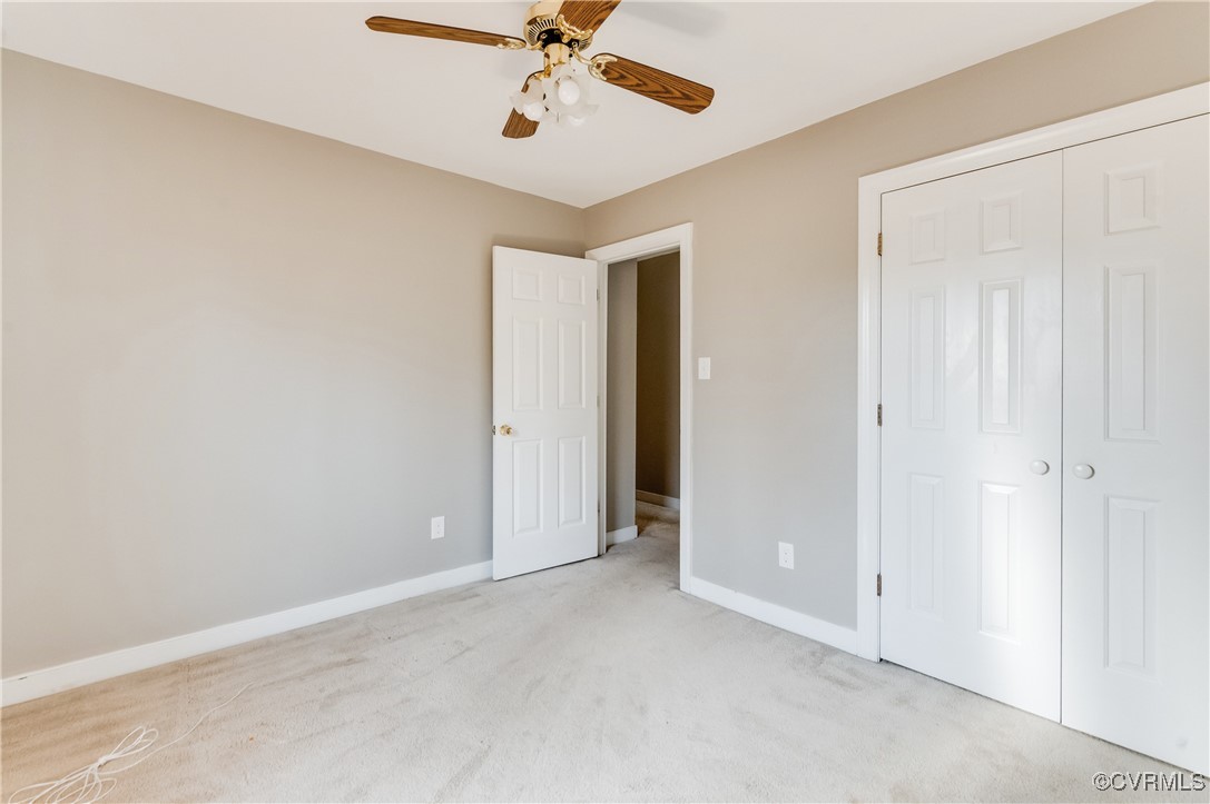 7400 Cannock Road Chesterfield, VA 23832 - Photo 23 of 36 an empty room with a ceiling fan and a window