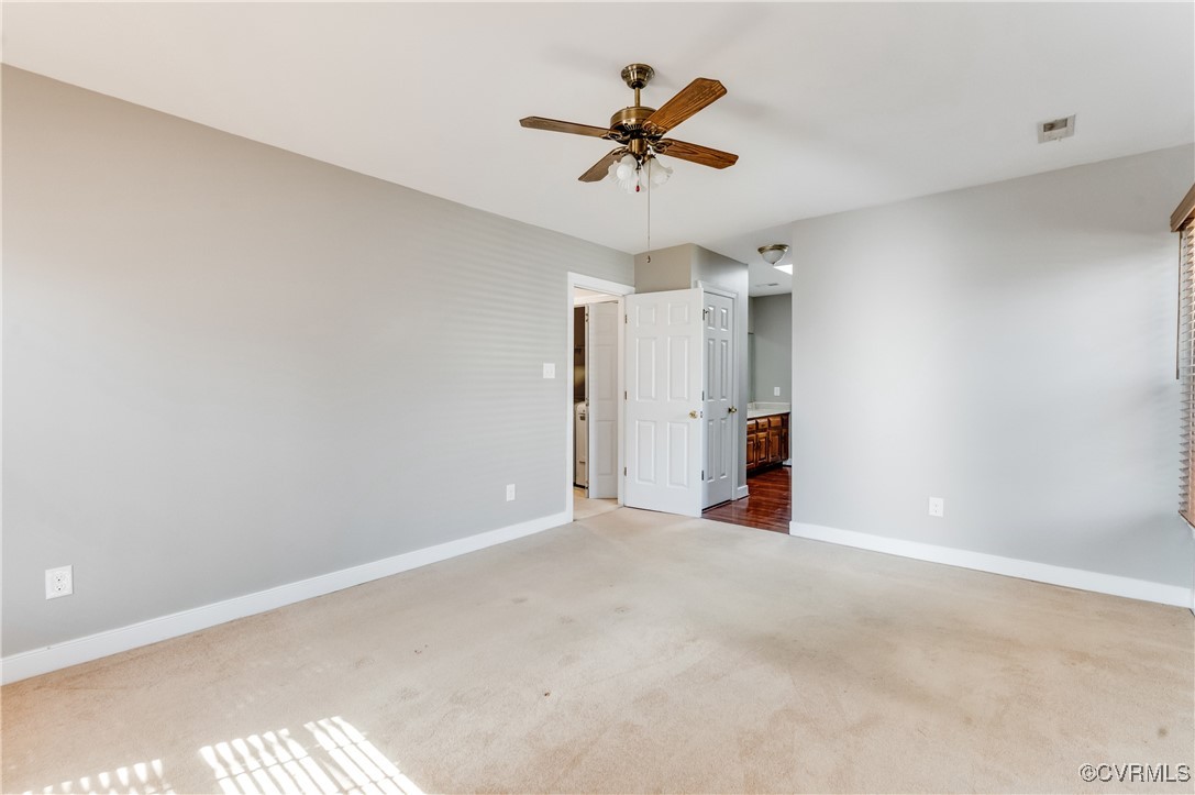 7400 Cannock Road Chesterfield, VA 23832 - Photo 24 of 36 a view of a livingroom with a ceiling fan and window